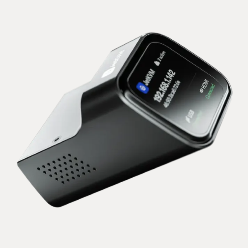 Angled product view of JetKVM KVM-over-IP controller featuring compact housing and side ventilation holes